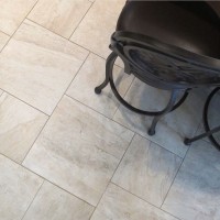 surface art assisi reale 18x18 12x12 pinwheel pattern travertine porcelain tile floors bar stools beige tan khaki installation