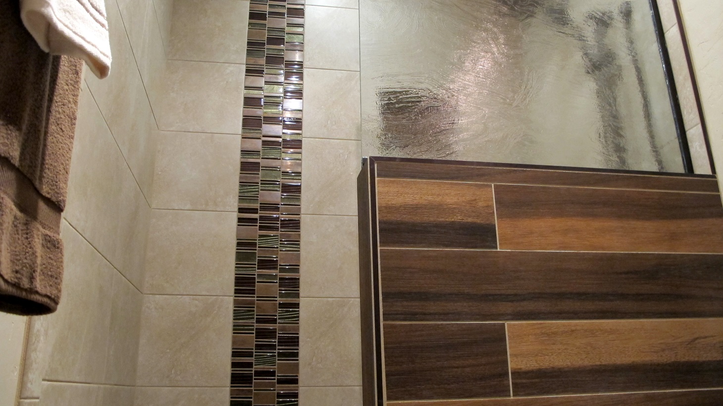 guest bathroom walk in shower shower pony wall glass stainless mosaic tile plank 6x36 Daltile Acacia Valley Ridge Kensington Beige Glazio Corrugated Series Ginger Clove 