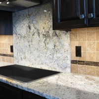 Kitchen backsplash rustic granite countertops tumbled travertine noce fashion accents daltile shimmer 5/8x3 umber decorative band stainless steel appliances electric cooktop full height