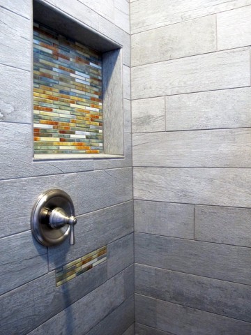 Wood planking tile shower with decorative accents by Dal Tile