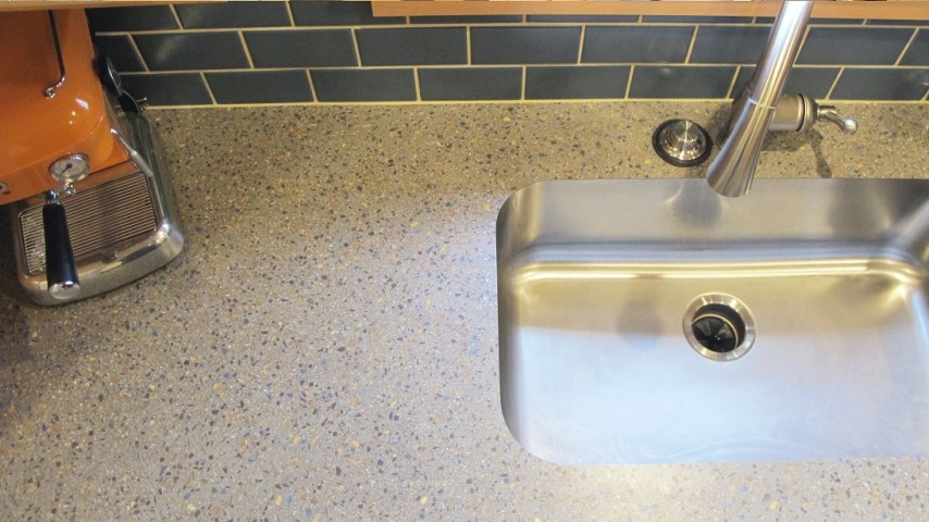 3x6 bimini blue subway tile meets Wilsonart laminate countertop in Venetian Ale complimented by a stainless steel undermount sink