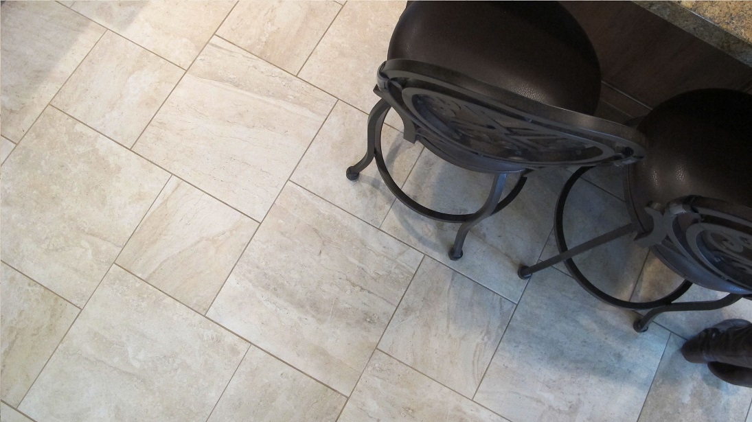 surface art assisi reale 18x18 12x12 pinwheel pattern travertine porcelain tile floors bar stools beige tan khaki installation