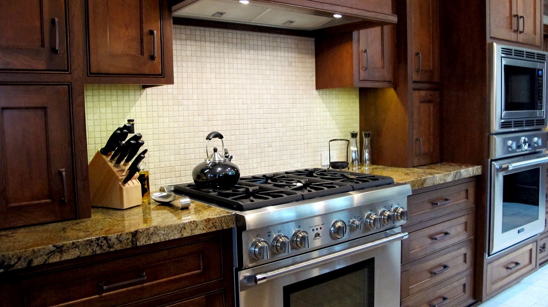 Kitchen traditional backsplash natural stone tumbled travertine mosaic 1x1 sheet light trav beige custom cabinets stainless steel cherry granite countertops gas range