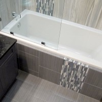 Contemporary modern stylish bathroom guest bath modern vanity vessel sink blue aqua iridescent Flow linear tile porcelain ceramic color body glass mosaics decorative border backsplash cabinets chrome shower tub Thompson Tile Cronin Blends S'tile Sky