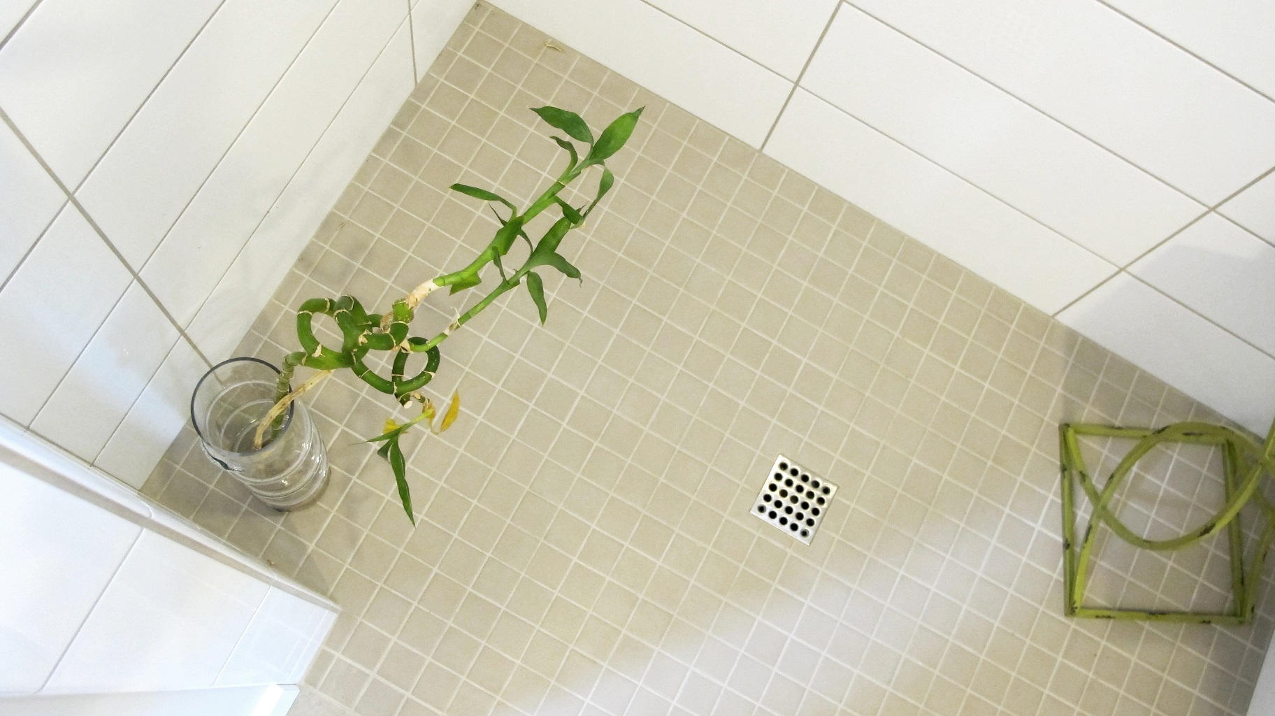 Walk-in shower floor mosaic square drain with Keystone Mosaic in color Uptown Taupe by Daltile Colour & Dimensions subway tile on walls by Thompson Tile in Arctic white