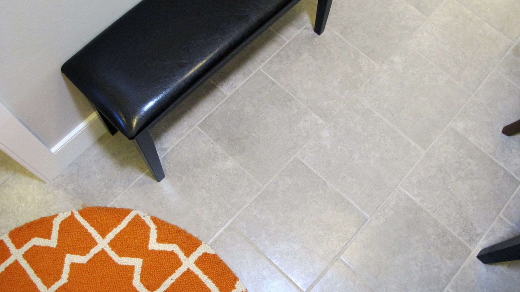 Floor tile Emser Baja 13x13 Tecate porcelain ceramic stagger lay orange decor rug circle black bench gray taupe light contemporary transitional installation