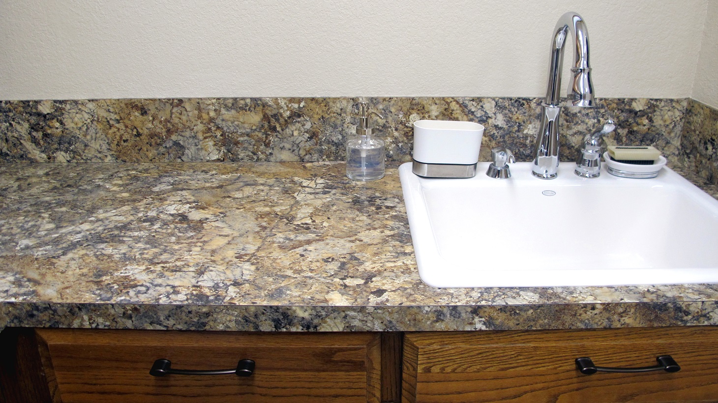 Laundry Room prep area surface countertop white porcelain sink utility laminate counter flat edge wilsonart Summer Carnival HD high definition backsplash 6" oak cabinets nutmeg brown gold neutral granite looking warm rustic elegant designer oil rubbed bronze chrome faucet