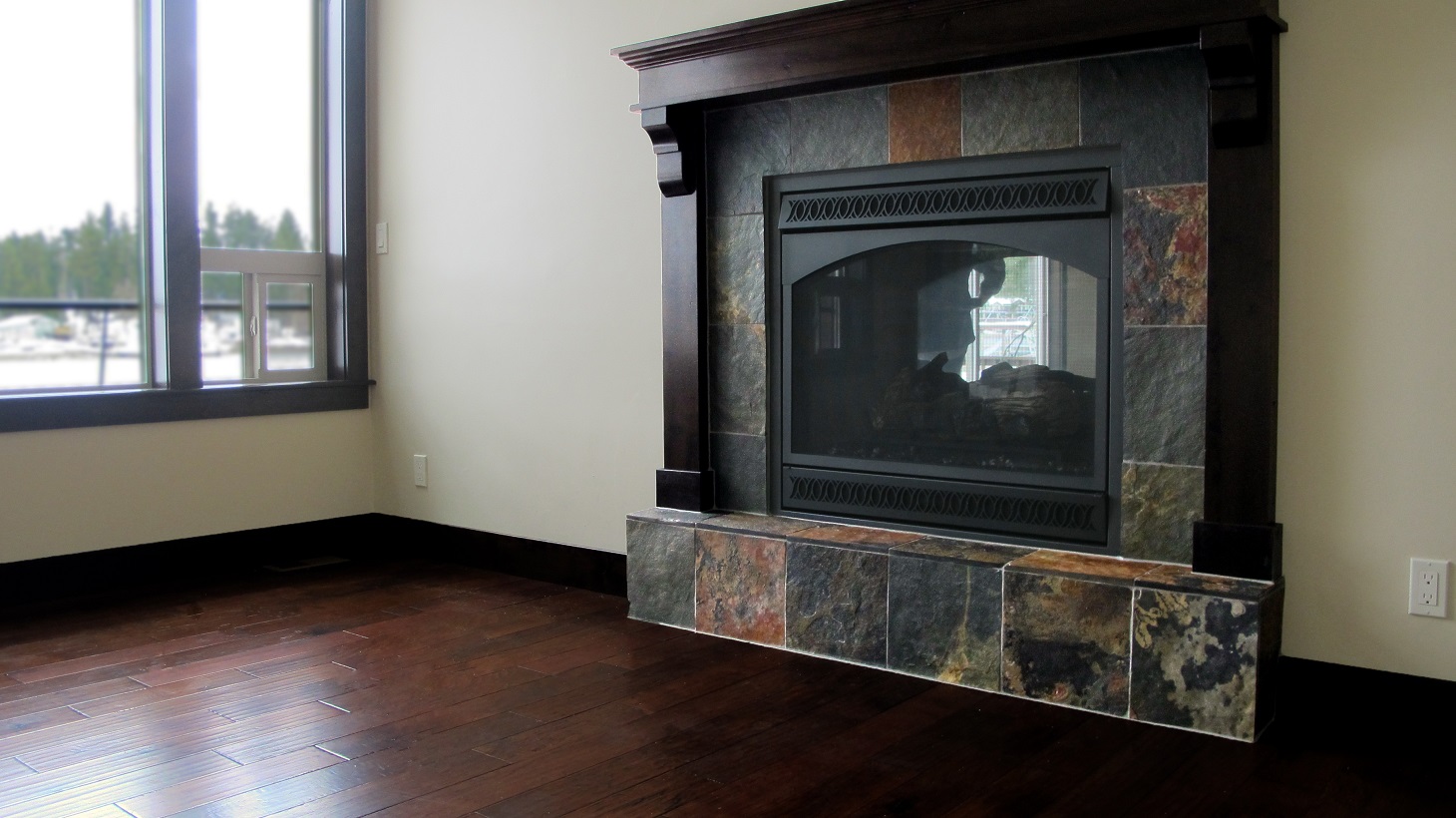 Fireplace hearth raised natural slate espresso wood mantel hardwood flooring Legends Hickory